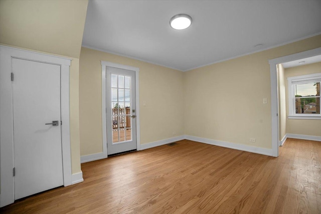6014 W Fletcher St, Chicago, IL 60634 - unfurnished room featuring ornamental molding, light wood-style flooring, and baseboards