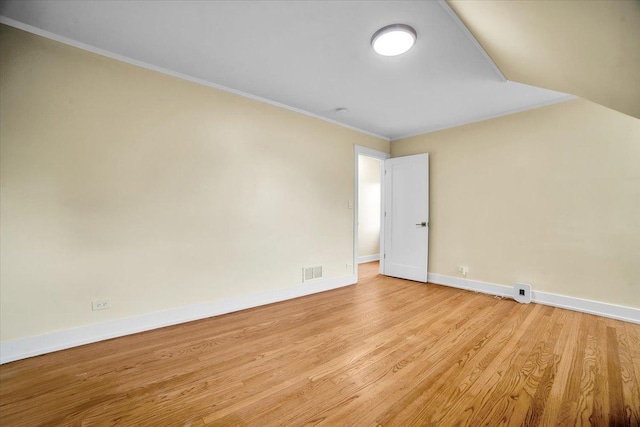 6014 W Fletcher St, Chicago, IL 60634 - unfurnished room featuring baseboards, light wood finished floors, and crown molding