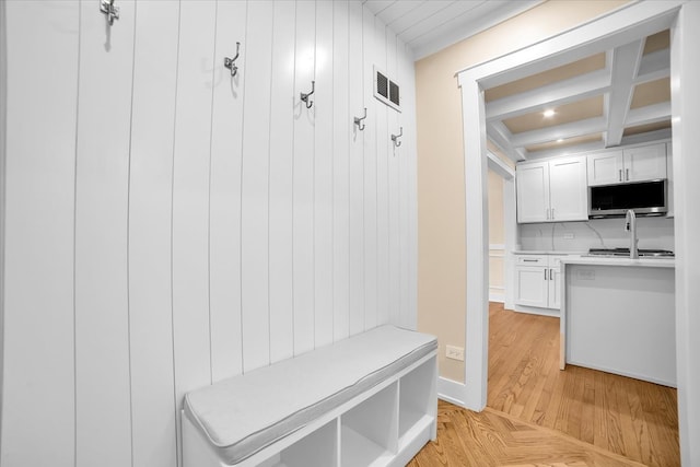 6014 W Fletcher St, Chicago, IL 60634 - mudroom with light wood-type flooring, coffered ceiling, and beam ceiling