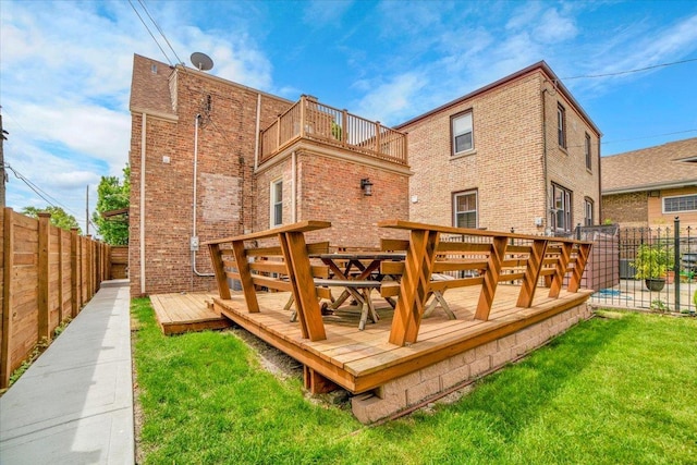 6014 W Fletcher St, Chicago, IL 60634 - back of property featuring a wooden deck, a balcony, and brick siding