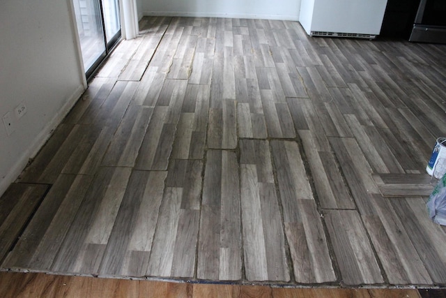 2364 S St Unit C, Elgin, IL 60123 - unfurnished room featuring wood finished floors and baseboards