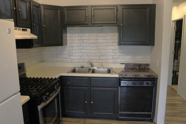 2364 S St Unit C, Elgin, IL 60123 - kitchen with stainless steel gas stove, dishwasher, a sink, freestanding refrigerator, and under cabinet range hood