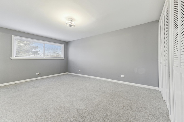 11423 S Calumet Ave, Chicago, IL 60628 - unfurnished bedroom with carpet flooring, baseboards, and a closet