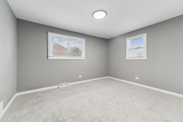 11423 S Calumet Ave, Chicago, IL 60628 - spare room featuring carpet and baseboards