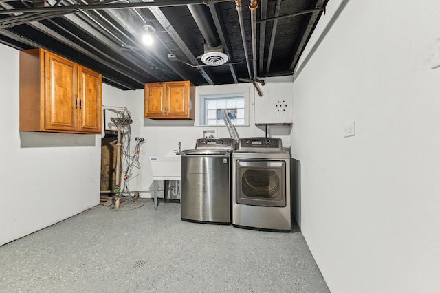 11423 S Calumet Ave, Chicago, IL 60628 - laundry room with cabinet space and washer and dryer