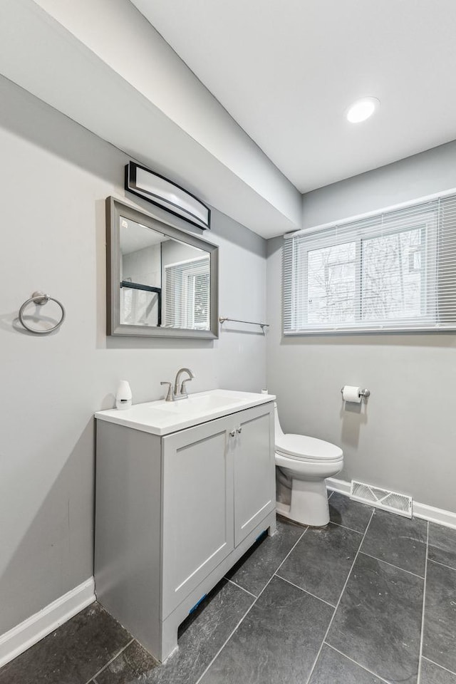 11423 S Calumet Ave, Chicago, IL 60628 - full bath with toilet, baseboards, vanity, and tile patterned flooring