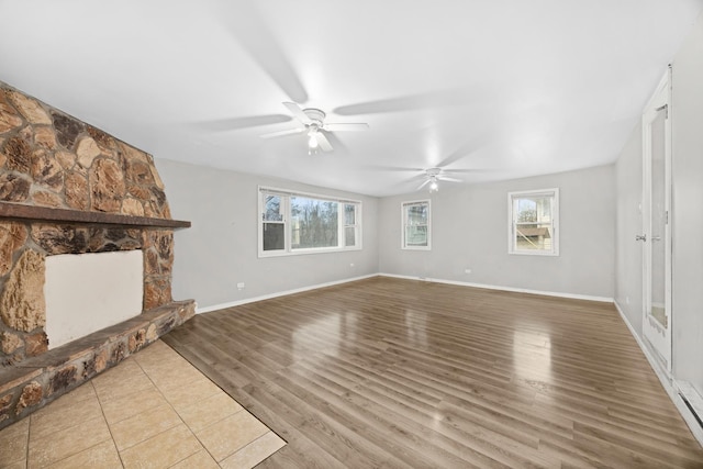17401 Holmes Ave, Hazel Crest, IL 60429 - unfurnished living room with ceiling fan, wood finished floors, and baseboards