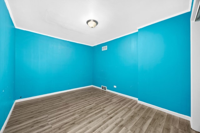 17401 Holmes Ave, Hazel Crest, IL 60429 - empty room featuring wood finished floors, crown molding, and baseboards