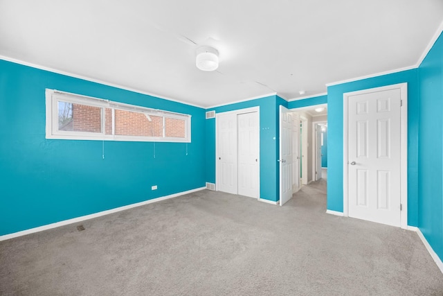 17401 Holmes Ave, Hazel Crest, IL 60429 - unfurnished bedroom with crown molding, baseboards, carpet floors, and a closet