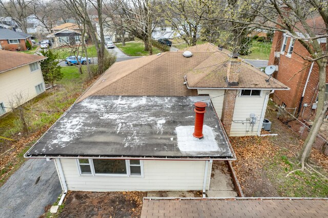 17401 Holmes Ave, Hazel Crest, IL 60429 - exterior view of a downspout, a rolled roof, gutters, and a residential view