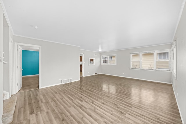 17401 Holmes Ave, Hazel Crest, IL 60429 - unfurnished living room with crown molding, wood finished floors, and baseboards