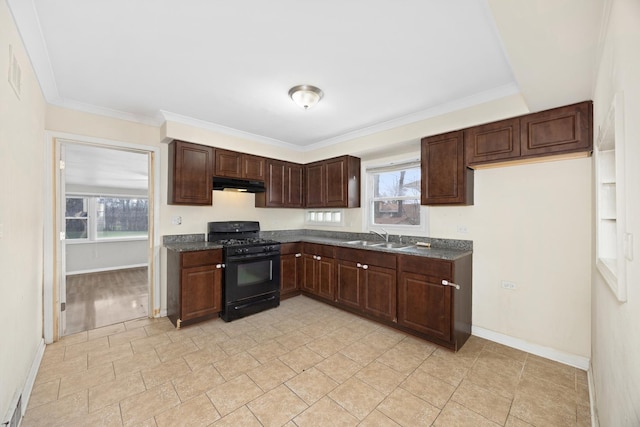 17401 Holmes Ave, Hazel Crest, IL 60429 - kitchen with black gas range, under cabinet range hood, a sink, dark countertops, and plenty of natural light