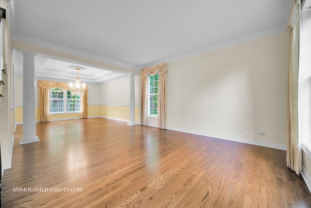 792 Black Walnut Dr, Sugar Grove, IL 60554 - unfurnished room featuring decorative columns, a chandelier, wood finished floors, and ornamental molding
