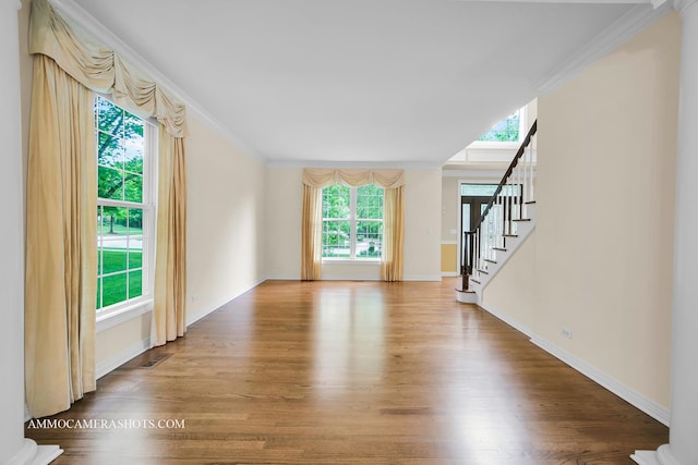 792 Black Walnut Dr, Sugar Grove, IL 60554 - unfurnished living room featuring wood finished floors, stairway, and crown molding