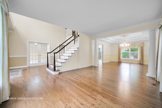 792 Black Walnut Dr, Sugar Grove, IL 60554 - unfurnished living room featuring a chandelier, french doors, stairs, wood finished floors, and ornamental molding