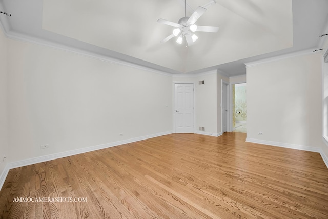 792 Black Walnut Dr, Sugar Grove, IL 60554 - spare room featuring a tray ceiling, light wood finished floors, ceiling fan, and ornamental molding