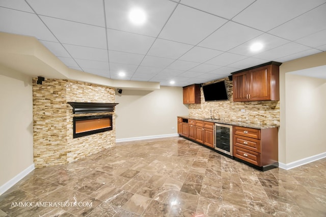 792 Black Walnut Dr, Sugar Grove, IL 60554 - indoor wet bar featuring wine cooler, a glass covered fireplace, tasteful backsplash, a paneled ceiling, and recessed lighting