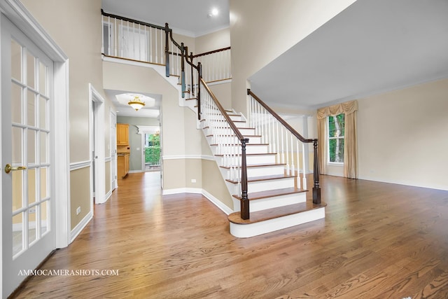 792 Black Walnut Dr, Sugar Grove, IL 60554 - entrance foyer with plenty of natural light, wood finished floors, stairway, ornamental molding, and a high ceiling