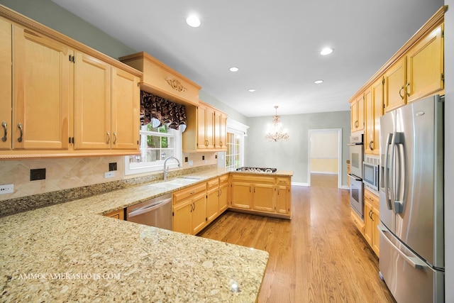 792 Black Walnut Dr, Sugar Grove, IL 60554 - kitchen with stainless steel appliances, a peninsula, a chandelier, light brown cabinets, and recessed lighting