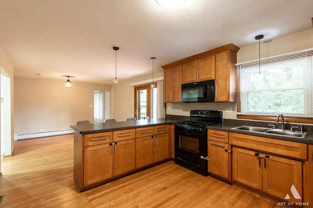 14940 Wilco Dr, Homer Glen, IL 60491 - kitchen with a sink, black appliances, a baseboard radiator, a peninsula, and brown cabinets