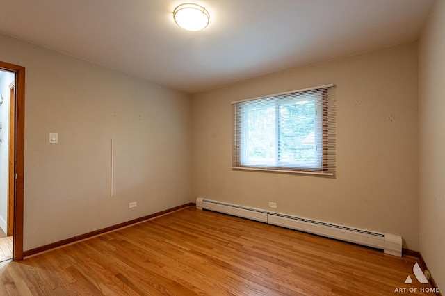 14940 Wilco Dr, Homer Glen, IL 60491 - empty room featuring baseboard heating, light wood-style floors, and baseboards