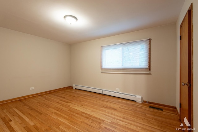 14940 Wilco Dr, Homer Glen, IL 60491 - unfurnished bedroom featuring a baseboard radiator, light wood finished floors, and baseboards