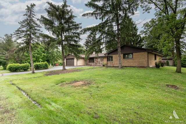14940 Wilco Dr, Homer Glen, IL 60491 - view of front of home with driveway, a front yard, brick siding, and a garage