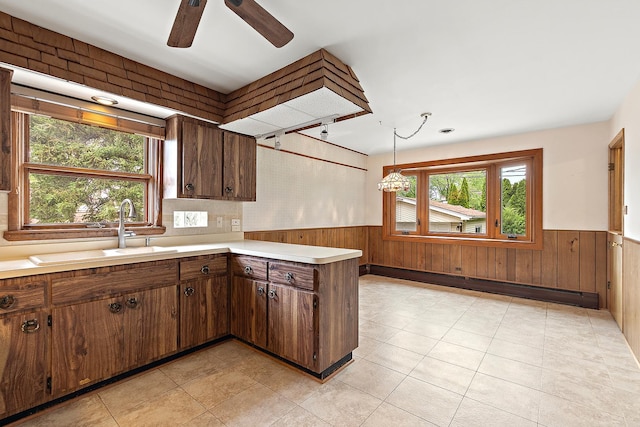 9017 S 50th Ave, Oak Lawn, IL 60453 - kitchen featuring baseboard heating, wainscoting, a sink, light countertops, and ceiling fan