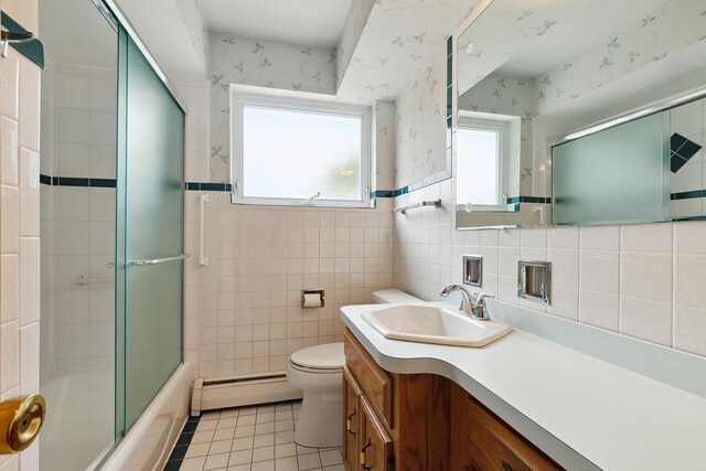 9017 S 50th Ave, Oak Lawn, IL 60453 - bathroom with baseboard heating, tile walls, wallpapered walls, tile patterned flooring, and toilet