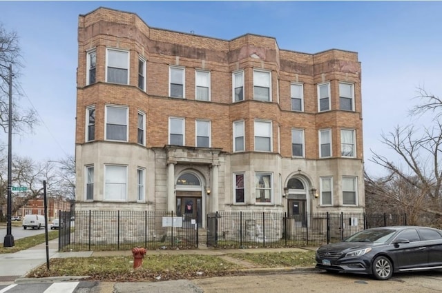 501 W 60th Pl Unit 3, Chicago, IL 60621 - view of building exterior with a fenced front yard