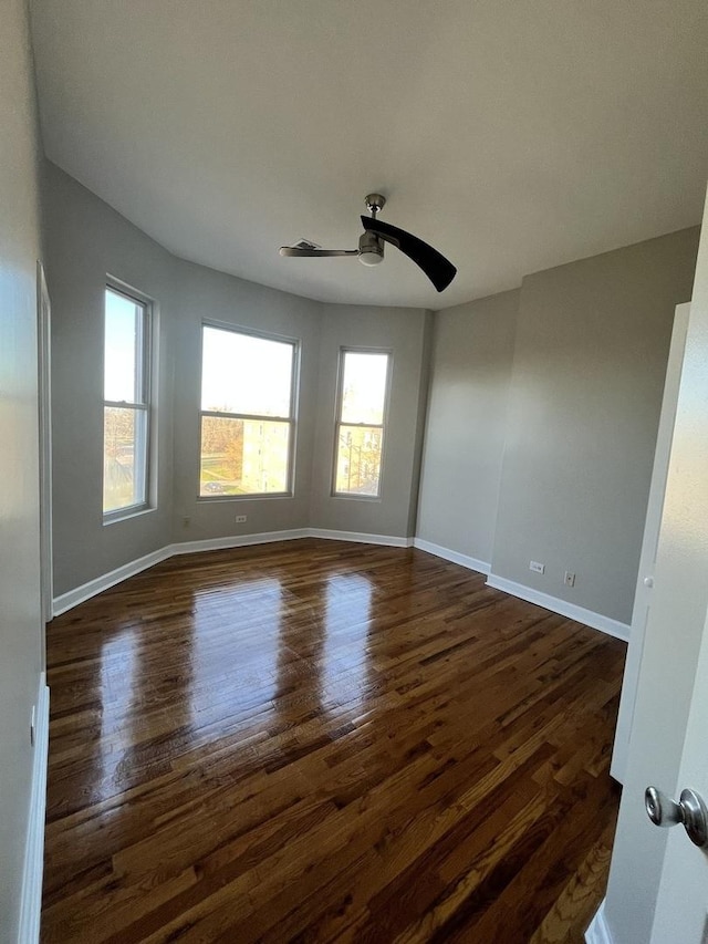 501 W 60th Pl Unit 3, Chicago, IL 60621 - unfurnished room with ceiling fan, dark wood-style floors, and baseboards