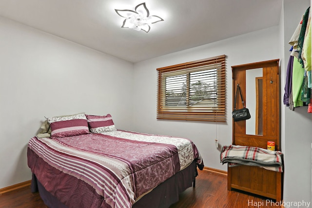 1428 Juneway Ter, Round Lake Beach, IL 60073 - bedroom featuring baseboards and wood finished floors