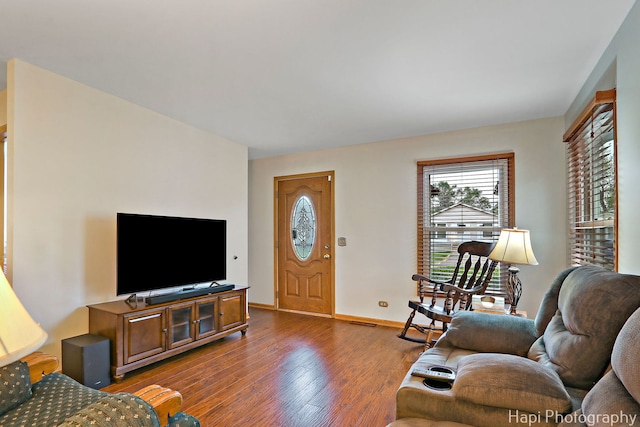 1428 Juneway Ter, Round Lake Beach, IL 60073 - living room with dark wood-style floors and baseboards