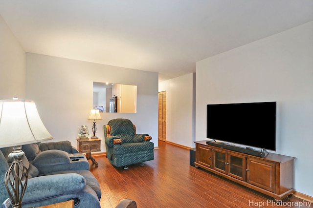1428 Juneway Ter, Round Lake Beach, IL 60073 - living area with dark wood-style flooring and baseboards