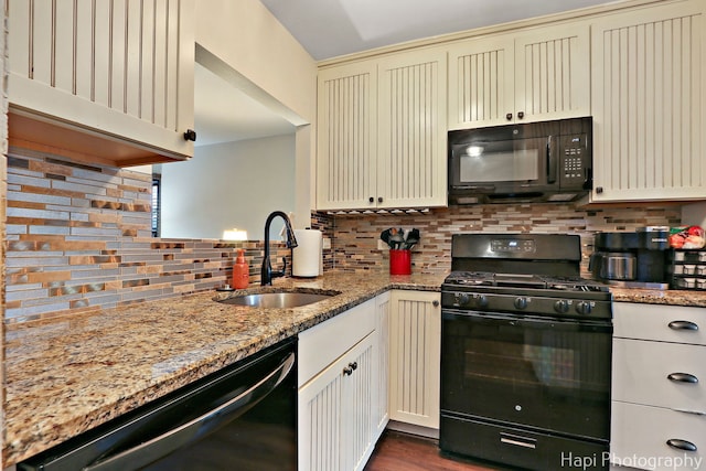 1428 Juneway Ter, Round Lake Beach, IL 60073 - kitchen with black appliances, a sink, cream cabinets, backsplash, and light stone countertops