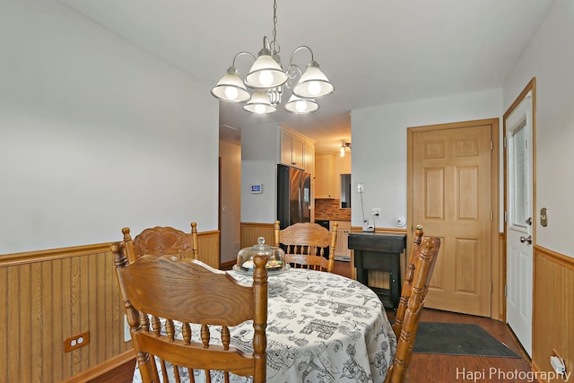 1428 Juneway Ter, Round Lake Beach, IL 60073 - dining space featuring a wainscoted wall, a chandelier, and dark wood finished floors