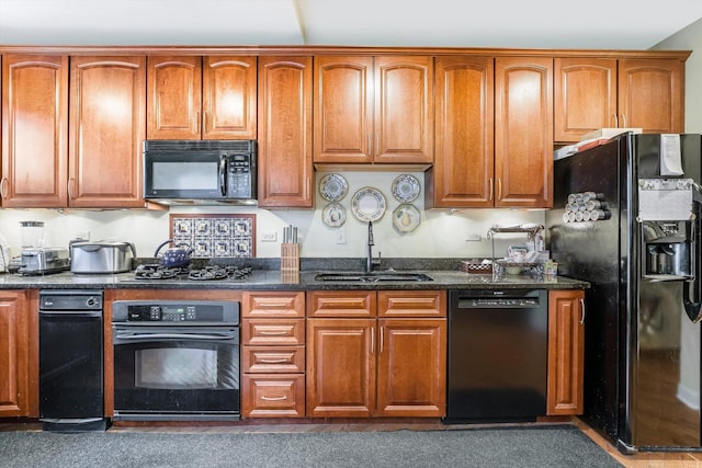 26 E 14th Pl, Chicago, IL 60605 - kitchen featuring black appliances, a sink, and brown cabinetry