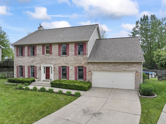 730 N Hundley St, Hoffman Estates, IL 60169 - colonial inspired home featuring roof with shingles, driveway, brick siding, an attached garage, and a chimney