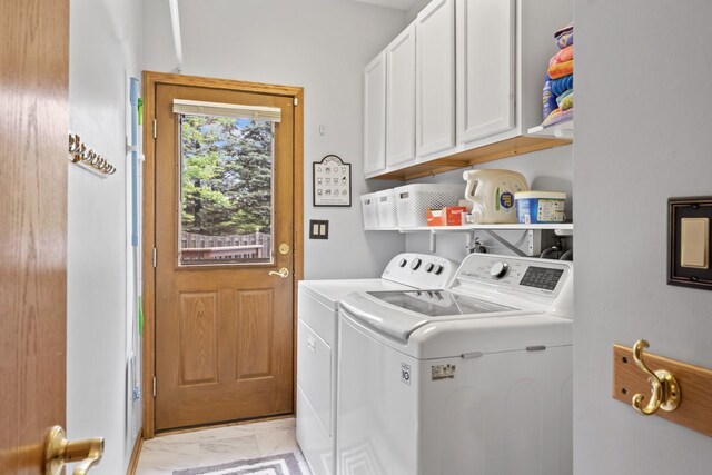 730 N Hundley St, Hoffman Estates, IL 60169 - washroom featuring independent washer and dryer, cabinet space, and light marble finish flooring