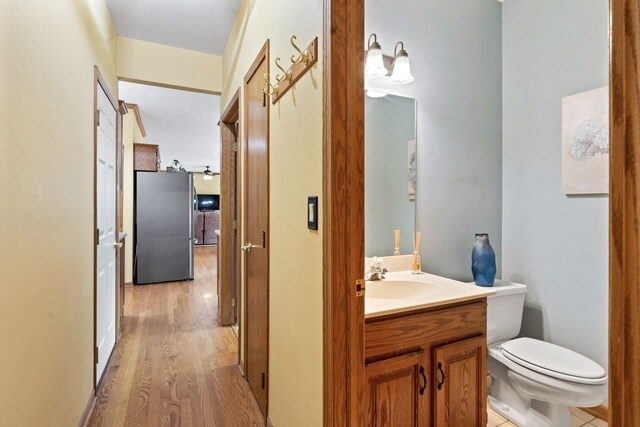 730 N Hundley St, Hoffman Estates, IL 60169 - bathroom with vanity, wood finished floors, and toilet