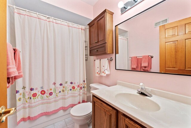 730 N Hundley St, Hoffman Estates, IL 60169 - bathroom with vanity, toilet, shower / bath combo, and tile patterned flooring