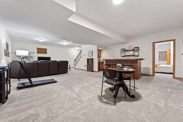730 N Hundley St, Hoffman Estates, IL 60169 - dining space with bar, light carpet, and baseboards