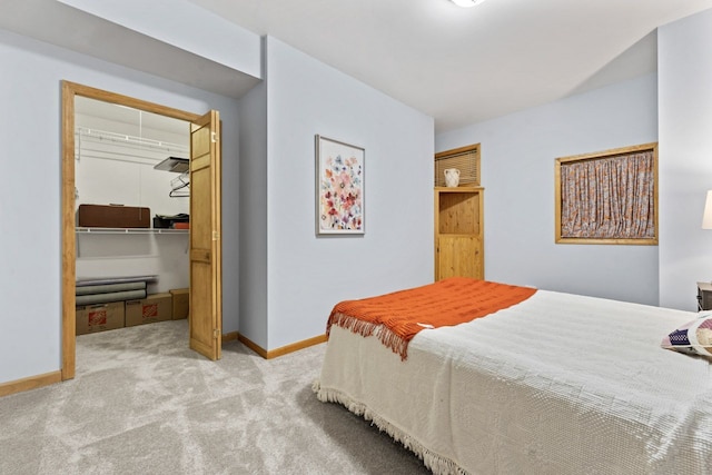 730 N Hundley St, Hoffman Estates, IL 60169 - carpeted bedroom featuring baseboards, a walk in closet, and a closet