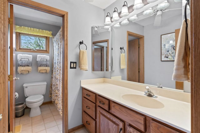 730 N Hundley St, Hoffman Estates, IL 60169 - full bathroom featuring toilet, vanity, tile patterned floors, and baseboards
