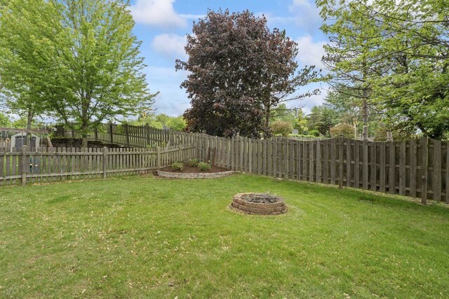 730 N Hundley St, Hoffman Estates, IL 60169 - view of yard featuring an outdoor fire pit
