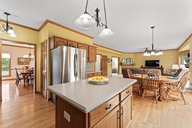 730 N Hundley St, Hoffman Estates, IL 60169 - kitchen featuring a chandelier, light wood-style flooring, pendant lighting, and crown molding