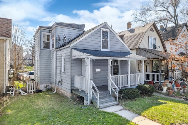 1661 Euclid Ave, Chicago Heights, IL 60411 - view of front facade with a porch, a front lawn, and a shingled roof