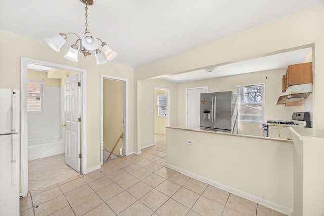 1661 Euclid Ave, Chicago Heights, IL 60411 - kitchen featuring stainless steel refrigerator with ice dispenser, gas stove, a chandelier, freestanding refrigerator, and under cabinet range hood