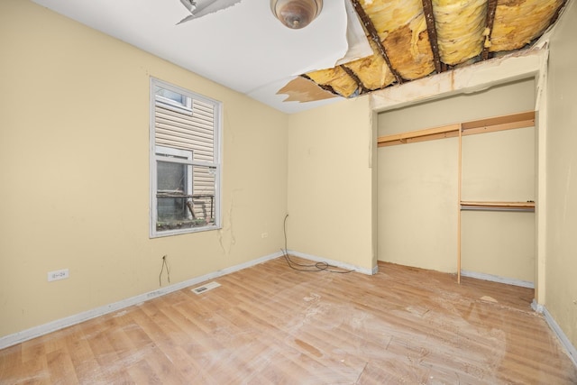 1661 Euclid Ave, Chicago Heights, IL 60411 - unfurnished bedroom with light wood-style flooring, a closet, and baseboards