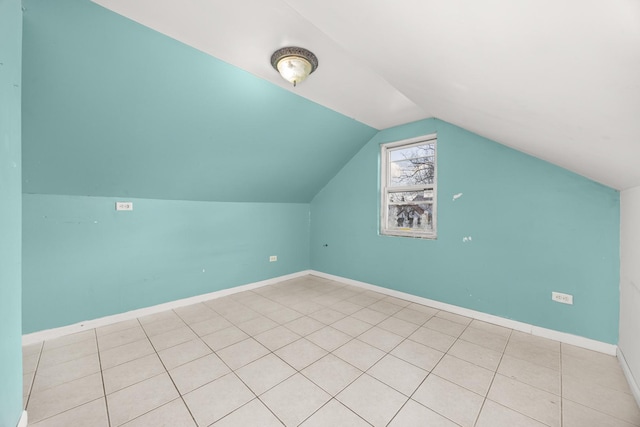 1661 Euclid Ave, Chicago Heights, IL 60411 - additional living space featuring vaulted ceiling, baseboards, and light tile patterned flooring